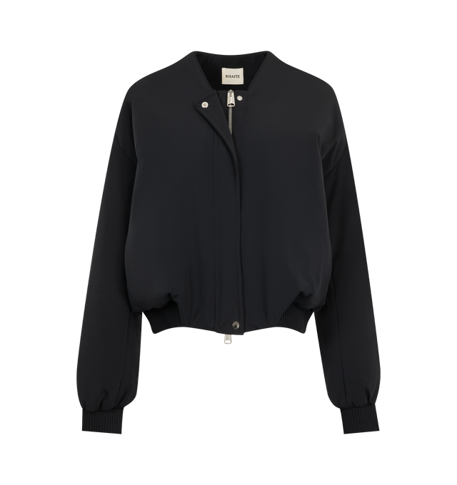 Image 4 of 4 - BLACK - Khaite Womens Cropped Bomber Jacket is crafted from double-face technical nylon. Features a cropped silhouette, front zip closure, rounded shape, signature armhole seaming, topstitched detailing, elasticized cuffs and hem, and in-seam side pockets. Main Material: 57% Nylon, 27% Polyurethane, 16% Elastane. Made in Italy.