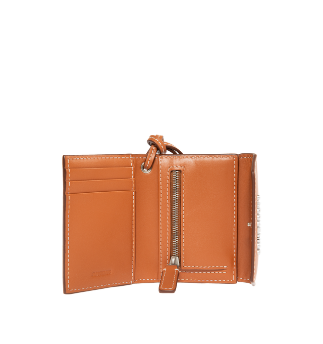 Image 3 of 3 - BROWN - JACQUEMUS Le Porte Jacquemus featuring envelope wallet, snap closure, card slots, interior zipped pocket, silver metal logo and hardware. 10.5 x 8 cm. Detachable knotted 17cm strap. 100% cowskin. Lining: 100% cotton. Made in Spain. 