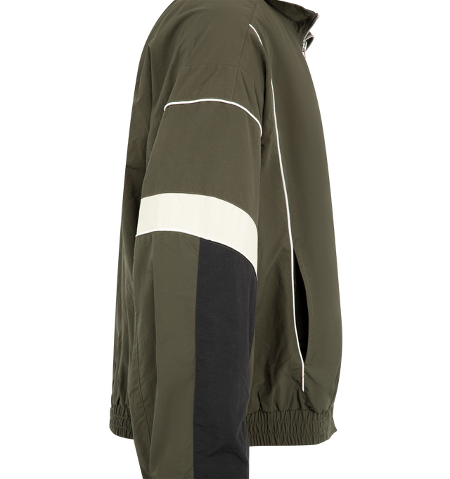 Image 3 of 3 - GREEN - Nahmias Men's Warm Up Jacket is crafted from premium performance fabric and features a relaxed silhouette with a full-zip front, stand collar, elasticated cuffs, and side pockets for everyday functionality. This designer warm-up jacket combines athletic-inspired styling with Nahmias' signature luxury streetwear aesthetic, creating a versatile layering piece for both casual and active wear. Main Material: Premium Nylon Performance Fabric.