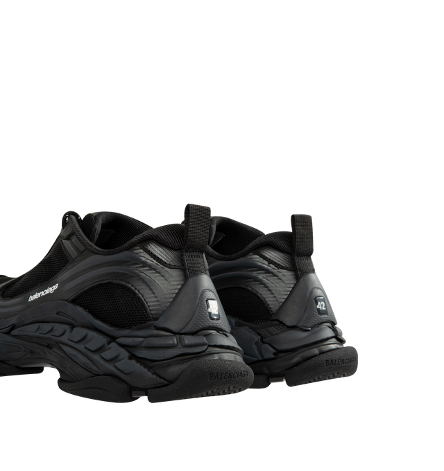 Image 3 of 5 - BLACK - Balenciaga Men's Triple S Clear Sole Sneaker is crafted from leather-free double foam and mesh and features the signature Triple S silhouette with a complex three-layer outsole incorporating Clear Sole technology. Detailed with an embroidered size at the toe edge, an embroidered logo at the side, an embossed logo at the back, and Triple S rubber branding at the tongue, this sneaker is finished with a 12-eyelet lacing system, bicolor hiking-inspired laces, an additional pair of laces,