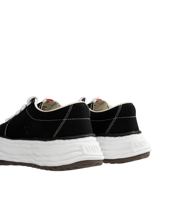 Image 3 of 5 - BLACK - Maison Mihara Yasuhiro Men's Eric Sneakers feature the brand's signature hand-sculpted OG sole, a mixed-material suede and canvas upper, and distinctive toe stitching for a bold contemporary look. Designed for the Spring/Summer 2026 collection, these designer low-top sneakers combine Maison Mihara Yasuhiro's experimental aesthetic with everyday comfort, while the handcrafted-inspired sole and intentional vintage detailing create a truly distinctive silhouette. Main Material: Cow Leath
