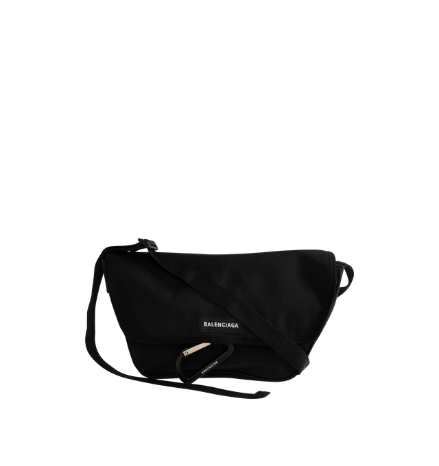 Image 1 of 3 - BLACK - BALENCIAGA Explorer Flap Messenger Bag Small in black washed recycled nylon featuring washed effect, adjustable strap (drop: 20.4 inch), crossbody and shoulder carry, Balenciaga patch at front, metal hook on the front, matte black hardware, flap closure, 1 main compartment, 1 inner zipped pocket and polyester and cotton blend lining. L12.8 x H3.9 x W2.9 inch. Polyamide and polyester. Made in Italy.