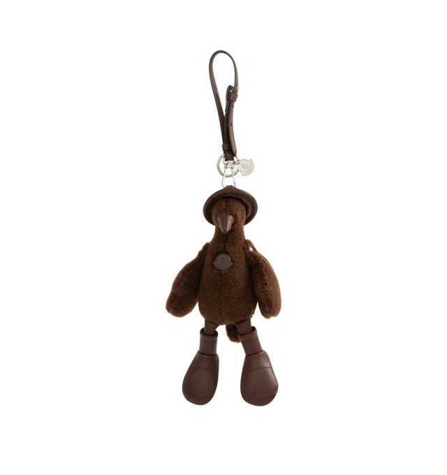 Image 1 of 4 - BROWN - MONCLER MonDuck Teddy Key Holder featuring faux leather details, carabiner with strap and metal logo. Measurements H 22 cm. 73% polyester, 27% acrylic. 100% polyester. 100% metal alloy. Made in Italy.