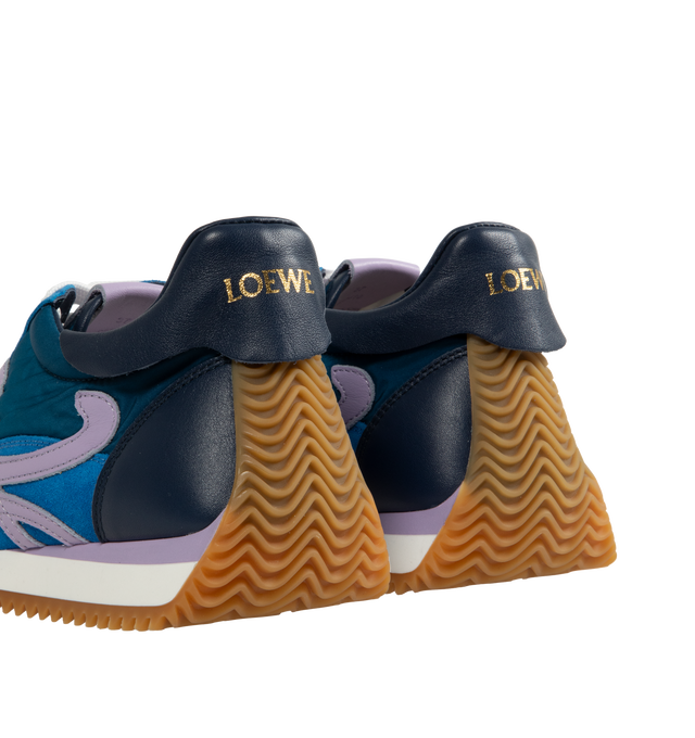 Image 3 of 5 - BLUE - LOEWE Flow Runner 2.0 featuring an updated ultra-flexible and lightweight construction, signature honey-coloured rubber outsole that extends from the toecap to the back of the heel, 25mm heel, signature L monogram on the side, embossed Anagram on the tongue and Gold embossed LOEWE on the heel tab. Runs a half-size larger. If between sizes, choose the smaller size. Nylon/Calf. Made in Italy.