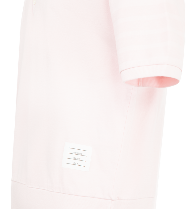 Image 3 of 3 - PINK - THOM BROWNE Garment Overdyed Jersey 4 Bar Polo featuring partial front button closure, ribbed collar, sleeve cuffs, and hem, overdyed 4-bar detailing, name tag appliqu, signature striped grosgrain loop tab and garment dyed. 100% cotton. Made in Italy.