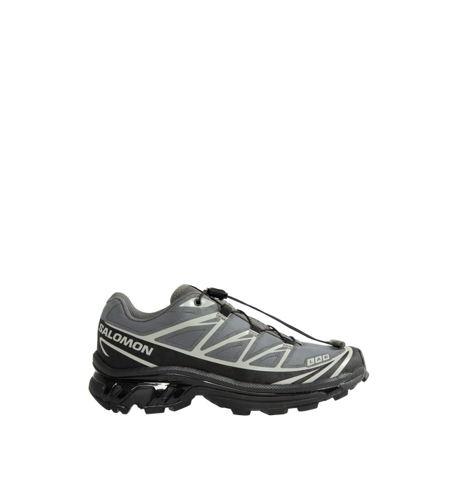 Image 1 of 5 - GREY - Salomon XT-6 Protective Sneakers are crafted from ripstop textile with textured TPU film overlays and feature the brand's iconic XT-6 silhouette reimagined through a durable workwear-inspired lens. Designed with Salomon's signature SensiFit construction, soft cushioning, and downhill stability technology, this technical style balances rugged functionality with everyday versatility. Main Material: Synthetic and Textile Upper. Lining: Textile. Insole: Textile. Outsole: Rubber. Closure: Q