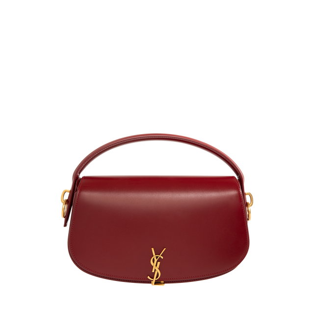 Image 1 of 3 - RED - SAINT LAURENT Voltaire Box Bag featuring half-moon shoulder bag in calfskin with a gently polished finish, flap with pivoting cassandre closure, an adjustable and detachable swivel-hook strap, leather lining, bronze-toned hardware and one flat pocket. 9.4" x 5.9" x 2". Handle drop: 2.4". Strap drop: 10.6". Calfskin leather. Made in Italy.