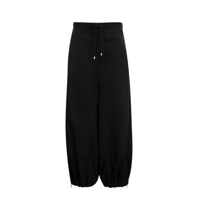 Image 1 of 3 - BLACK - LOEWE Trousers in lightweight technical fabric featuring a balloon silhouette, elasticated zipped cuffs, relaxed fit, regular length, mid waist, loose leg, adjustable drawstring waist, concealed hook fastening and zip fly, slash pockets and Anagram embroidery placed at the front. Cupro. Made in Italy.