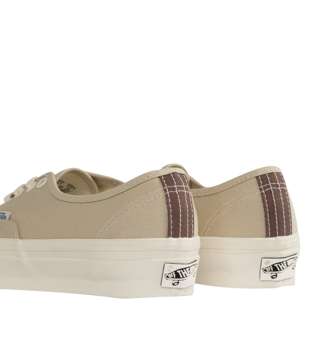 Image 3 of 5 - NEUTRAL - VANS Authentic Reissue 44 LX Sneakers featuring low-top, lightweight canvas upper,  lace-up closure, logo flag at outer side, rubber logo patch at heel, textured rubber midsole, treaded rubber sole and contrast stitching in white. Upper: canvas. Sole: rubber.  