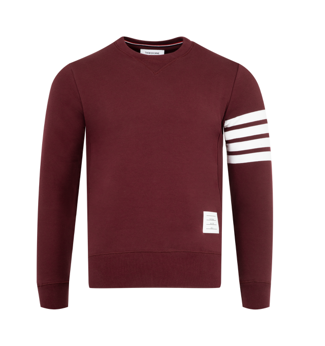 Image 1 of 2 - RED - THOM BROWNE Classic Loopback 4-Bar Sweatshirt featuring crew neckline with v patch, engineered 4-bar stripe detail at left sleeve, name tag applique above hem, buttoned side vents with signature striped grosgrain trim and signature striped grosgrain loop tab at back of neck. 100% cotton. Made in Japan.