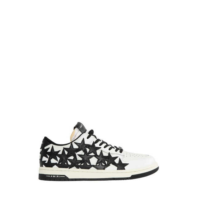 Image 1 of 5 - BLACK - AMIRI Stars Leather Low-Top Sneakers featuring flat heel, round toe, logo on the tongue and heel, lace-up vamp, star clusters on the side and rubber outsole. 