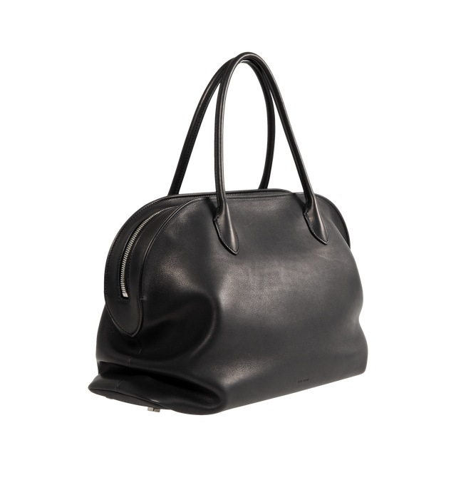 Image 2 of 3 - BLACK - The Row Agnes 15 Bag is crafted from a smooth calfskin leather and features a softly structured top-handle silhouette with tubular handles, gusseted side folds, a curved top zip closure, and a flat base. This designer leather handbag combines exceptional Italian craftsmanship with a spacious, minimalist design, while the naturally finished, metal-free tanned calfskin offers an exceptionally soft touch. Main Material: 100% Calfskin Leather. Lining: 100% Lambskin Leather. Dimensions: 17