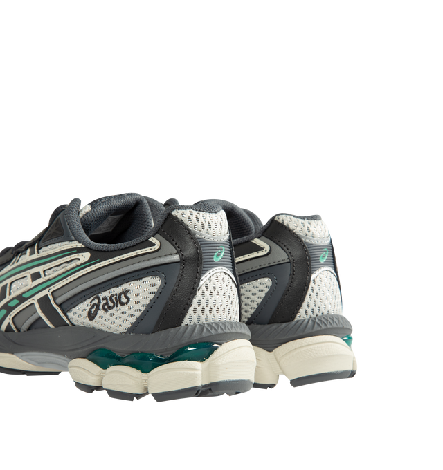 Image 3 of 5 - GREY - ASICS GEL-NYC 2055 Sportstyle sneaker with early 2000s running shoe design influences in the upper's ASICS stripes, heel counter, and eyelet structure. Featuring GEL-CUMULUS 16 shoe's tooling system. Through a combination of lightweight foams and GEL technology inserts, this midsole formation helps create advanced underfoot comfort. Unisex style in men's sizing. Imported from Cambodia.