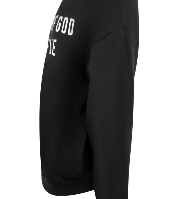 Image 3 of 3 - BLACK - FEAR OF GOD ESSENTIALS 90s Fit Fleece Hoodie featuring cotton-blend fleece hoodie, rubber logo patch at hood, logo appliqus at front, seam pockets at waist, rib-knit hem and cuffs and dropped shoulders. 80% cotton, 20% polyester.