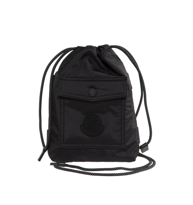 Image 1 of 3 - BLACK - MONCLER Makaio Drawstring Bag featuring water-repellent nylon lining, leather trim, climbing cord drawstring closure, outer pocket, inner media pocket, climbing cord shoulder strap and silicone logo patch. L 18 cm x H 23 cm x W 2 cm. 100% polyamide/nylon. 