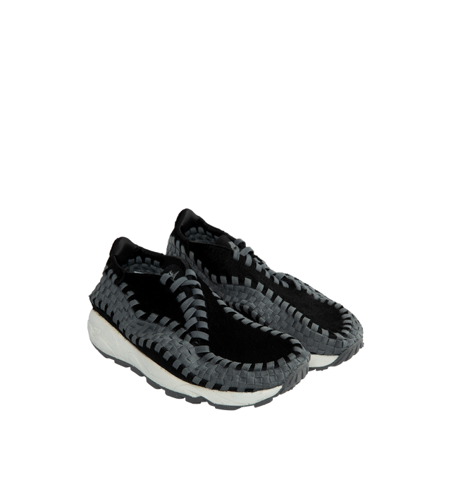 Image 2 of 5 - BLACK - NIKE Air Footscape Sneakers featuring graphic pattern printed throughout, offset lace-up closure, logo embroidered at tongue and heel counter, logo embossed at heel, suede lining, foam rubber midsole and treaded rubber outsole. 