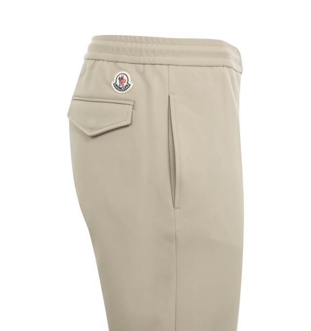 Image 3 of 3 - WHITE - Moncler Polished Cotton Jogging Pants have a satin feel, zipper closure, drawstring waist, snap button back pockets, and a leather logo patch. 100% cotton.
