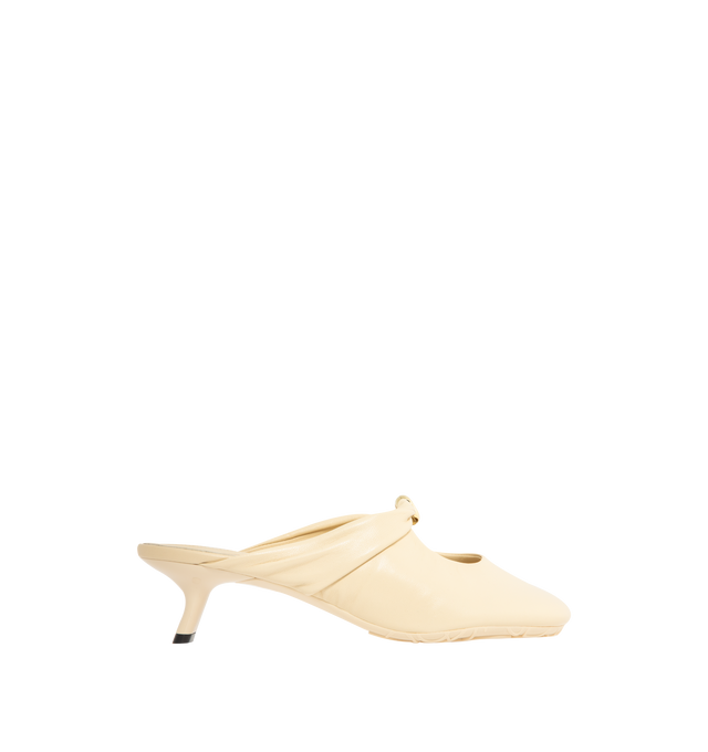Image 1 of 4 - NEUTRAL - Loewe Women's Pebble Soft Mule in supple nappa lambskin with a flexible upper engineered for extra comfort, featuring a metallic pebble with an Anagram engraved detail, a signature petal toe shape, 45mm heel, engraved Anagram on Pebble, padded leather insole and Anagram embossed rubber outsole. Heel height: 4.5 cm. Nappa lambskin. Made in Italy.