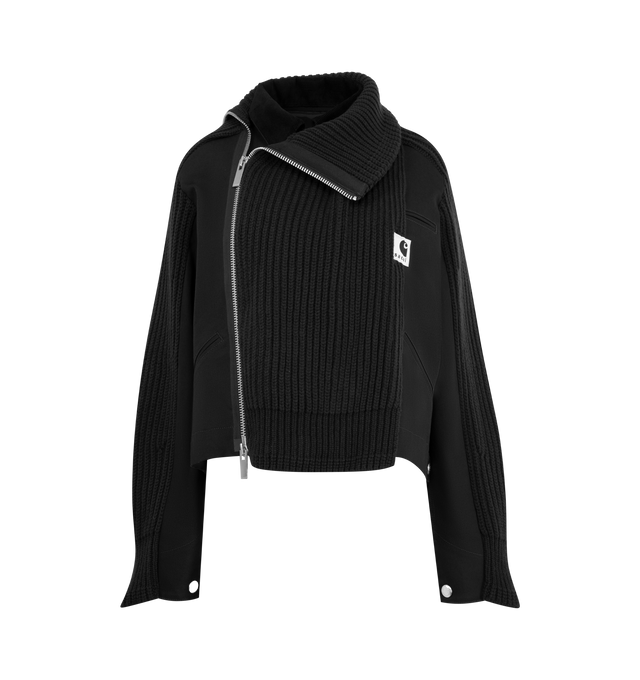 Image 1 of 4 - BLACK - Sacai x Carhartt WIP Women's Duck x Wool Knit Blouson is a hybrid of Carhartt WIPs Detroit Jacket and sacais knit blouson. Featuring two front layers on the body and sleeves, made from Carhartt WIPs duck canvas fabric, with rib-knit, spun wool and nylon yarn, an asymmetric front opening with a double zipper, and a high neck that can be worn up or down to form a flat collar, and co-branded woven label. A co-branded woven label appears on the front. Organic cotton canvas, Knit material