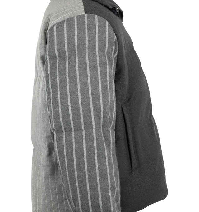 Image 3 of 3 - GREY - Thom Browne Men's Down-Filled Jacket is crafted from chalk stripe wool flannel and features a down-filled construction, a two-way front zip closure with T-pull, a stand collar, and an internal rib-knit collar inspired by technical skiwear. Designed with welt hand pockets with hidden zip closures, four internal pockets, detachable internal backpack straps, rib-knit storm cuffs, striped lining, and the brand's signature striped grosgrain loop tab, it balances performance-focused details