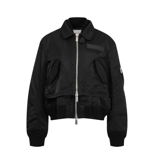 Image 1 of 4 - BLACK - Sacai Nylon Twill Blouson is crafted from nylon twill with lightweight padding. Features a blouson silhouette, mixed-media paneling, full lining, and modern utility-inspired construction. Outer: 100% Nylon; Parts: 55% Polyester, 44% Cotton, 1% Polyurethane; Lining: 100% Polyester; Filling: 100% Polyester. Made in Japan.