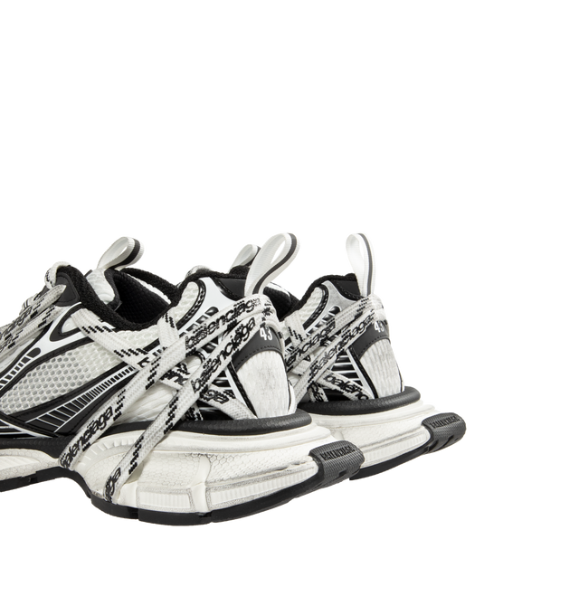 Image 3 of 5 - WHITE - BALENCIAGA 3XL Extreme Laces Logo Sneaker featuring worn-out effect, multiple lace details with Balenciaga logo all around the upper and on the sole, Balenciaga logo at the edge of the toe and at back, embossed size on the upper and at the back of the heel, 3XL rubber branding on the tongue with reflective detail and back and tongue pull-on tab with reflective detail. Upper: polyester, polyurethane. Sole: rubber, EVA. Insole: foam. Made in China.