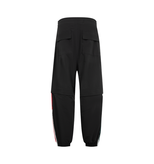 Image 2 of 4 - BLACK - Adidas Mens Convertible Woven Pants feature a woven construction with zip-off lower legs for convertible wear. Designed with an elastic waistband, zip closures at the knees, applied 3-Stripes along the upper and lower legs, embroidered logos and artwork, and side pockets. Made in Indonesia.