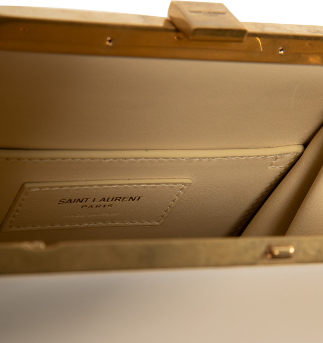 Image 3 of 3 - CHAMPAGNE - SAINT LAURENT Nuit Blanche Handbag featuring a square clasp engraved with the SAINT LAURENT PARIS signature, leather lining, bronze-toned hardware and sliding clasp closure. 6.7" x 6.7" x 1.6". Calfskin. Made in Italy.