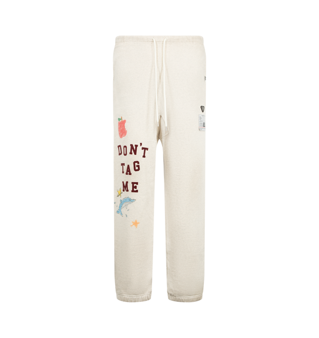 Image 1 of 3 - WHITE - Maison Mihara Yasuhiro Men's Doodle Print Sweat Pants are crafted from brushed cotton and features a relaxed silhouette, side pockets, an original embroidered patch, and graphic prints inspired by children's doodles. Designed with the brand's signature artistic approach, this casual style combines soft comfort with expressive allover artwork. Main Material: 100% Cotton. Made in Japan.