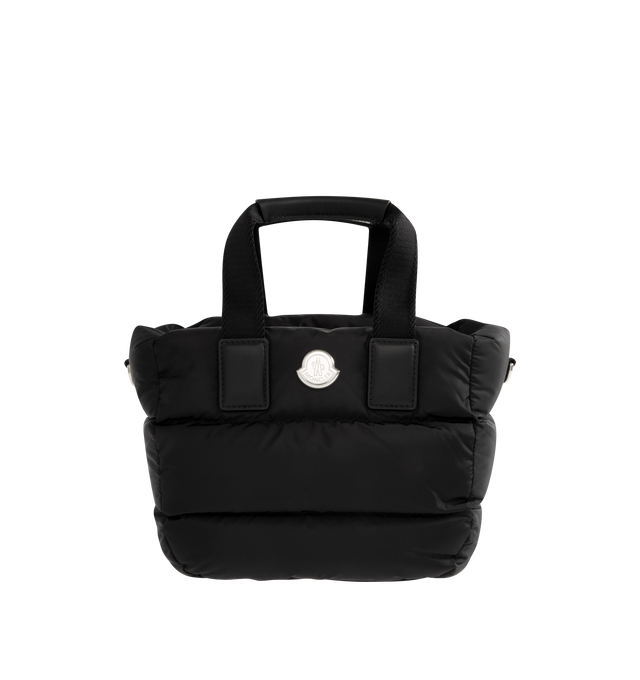 Image 1 of 3 - BLACK - MONCLER Caradoc Water-Repellent Mini Tote Bag featuring water-repellent nylon, nylon drill lining, down-filled, ribbon handles with leather grip, adjustable and detachable leather shoulder strap, zipper closure and metal logo. L 30 cm x H 20 cm x D 13 cm. 100% polyamide/nylon. Lining: 95% cotton, 5% acrylic. Padding: 90% down, 10% feather.