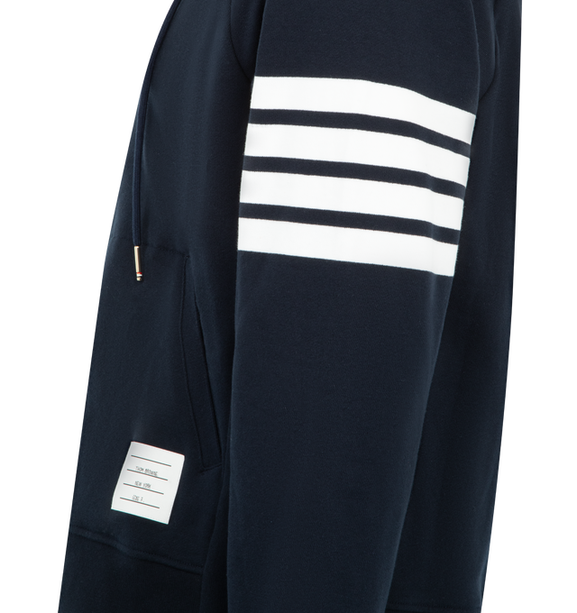 Image 3 of 3 - NAVY - THOM BROWNE Classic Loopback 4 Bar Zip Up Hoodie featuring brass 2-way zip closure, integrated hood with stripe trim, 4-bar stripe detail at left sleeve and kngaroo front pocket with name tag applique. 100% cotton. Made in Japan.