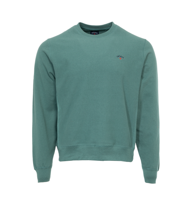 Image 1 of 3 - GREEN - NOAH Core Logo Pocket T-shirt featuring embroidered logo on chest, crew neck, long sleeves and ribbed cuffs, hem and collar. 100% cotton.  