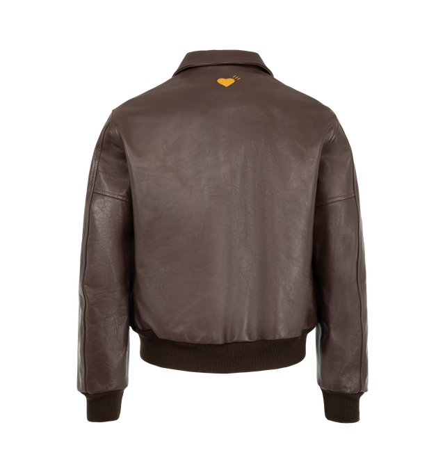 Image 2 of 3 - BROWN - Human Made Men's Leather Jacket is crafted from cow leather and features a classic silhouette with a quilted polyester taffeta lining for added comfort and warmth. Designed with heart-shaped cutout detailing across the front, this statement outerwear style is finished with signature yellow heart logos at the left chest and back, along with rib-knit cuffs and hem for a secure fit. Main Material: Cow Leather. Lining: Quilted Polyester Taffeta.