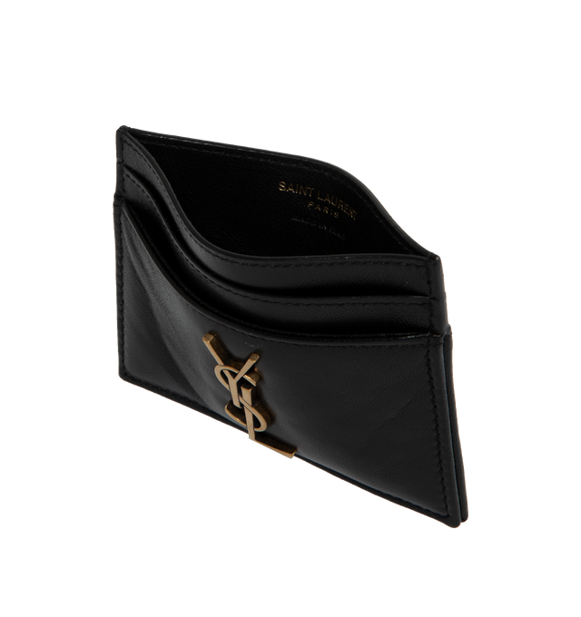 Image 3 of 3 - BLACK - SAINT LAURENT Card Holder featuring leather exterior and interior, gold-tone cassandre hardware at front, 4 card slots and center compartment. 4" W x 3" H. 