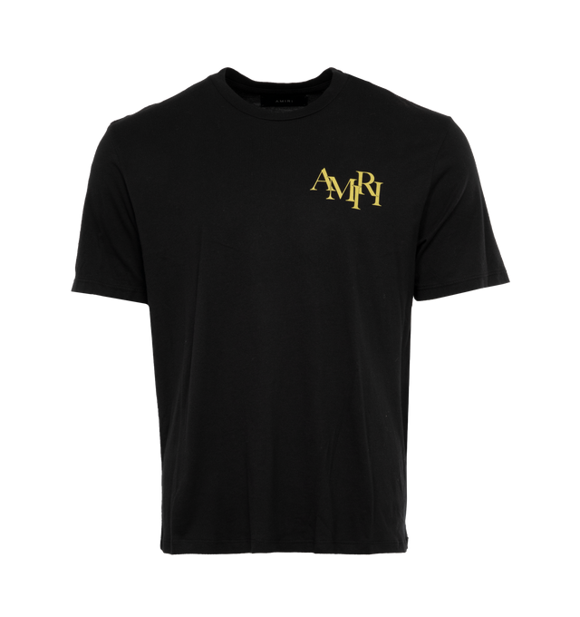 Image 1 of 4 - BLACK - AMIRI CRYSTAL CHAMPAGNE TEE has a bold Amiri logo lettering and a graphic motif on the back in a yellow gold color. This soft style provides an effortless fit, crewneck, short sleeves and pulls over. 100% cotton. 