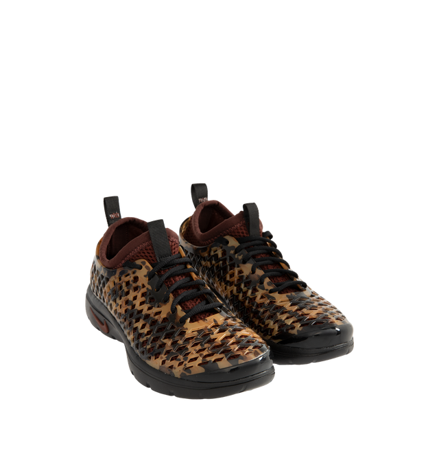 Image 2 of 6 - BROWN - Nike Women's Rejuven8 Run Sneakers feature a black and brown tortoise shell-patterned synthetic upper with a removable mesh bootie and lightly padded collar. Flat laces, heel and tongue pull tabs, a mini Swoosh at the back heel, and Swoosh branding on the sole unit complete the design. ReactX foam provides responsive cushioning, while a rubber outsole offers durable traction. Upper: Synthetic. Bootie: Mesh. Midsole: ReactX Foam. Sole: Rubber.