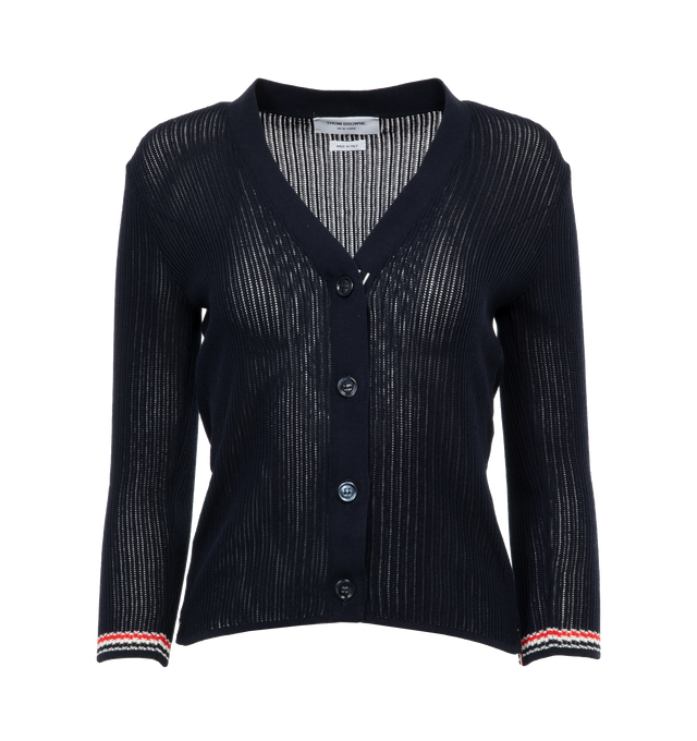 Image 1 of 3 - NAVY - THOM BROWNE Pointelle Stitch Cardigan featuring v-neck, front button closure  with striped grosgrain placket, stripe detailing on cuffs and hem and signature striped grosgrain loop tab. 70% cotton, 30% silk. 