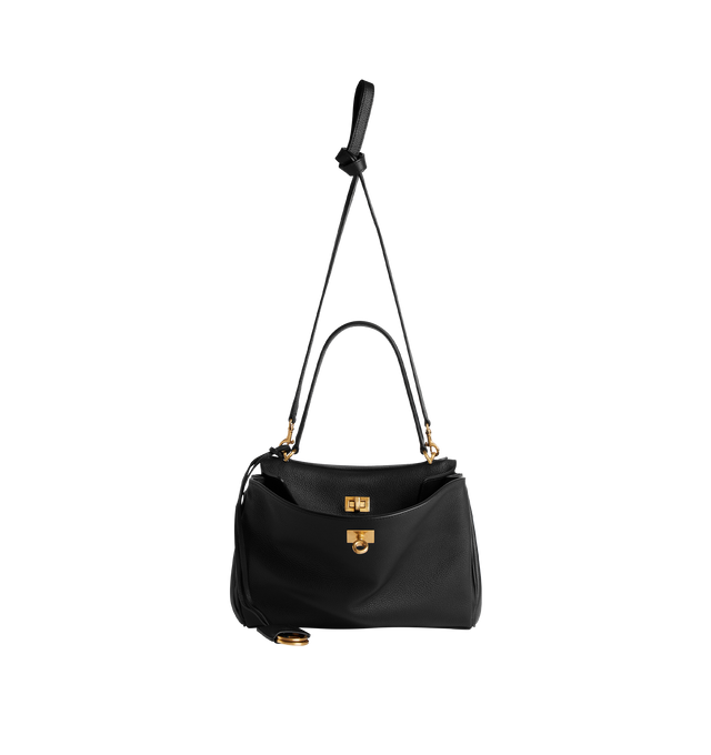 Image 3 of 4 - BLACK - BALENCIAGA Rodeo Handbag Small featuring smooth calfskin, one handle, removable shoulder strap, removable cloche cls with two split rings, aged-gold hardware, turn lock closure, wide front pocket, 1 main compartment, 1 inner zipped pocket, 2 flat pockets at back, side snaps, 4 brass feet and nappa lambskin lining. Calfskin. Made in Italy.