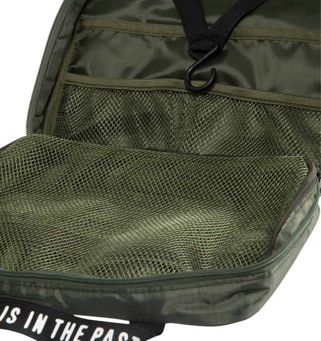 Image 3 of 3 - GREEN - HUMAN MADE Organizer Pouch featuring a tri-fold design, lightweight, durable ripstop fabric, iconic heart logo on the front, handle with a logo print, several multi-pockets and S-shaped hook attached for hanging storage. 100% polyester.