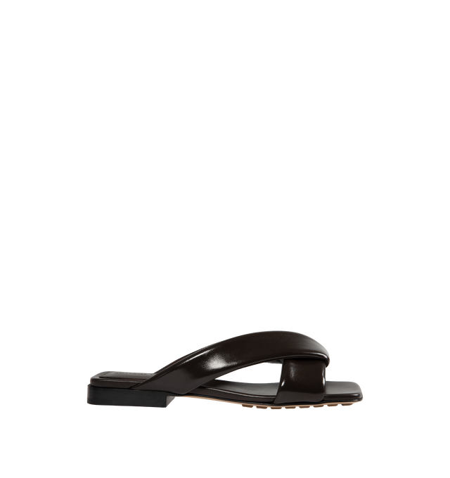 Image 1 of 4 - BLACK - BOTTEGA VENETA Riva Flat Mule featuring shiny calfskin with padded tubular straps and twisted design. Calfskin. Lining: lambskin. Made in Italy.
