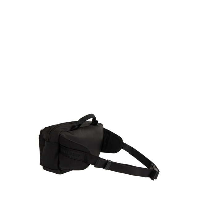 Image 3 of 4 - BLACK - GIVENCHY Essential U Belt Bag in nylon featuring handle on the top, zipper closure with leather zipper pull, adjustable GIVENCHY webbing strap for a crossbody carry, metal GIVENCHY signature on the front, silvery-finish metal details, one main zipped compartment and two zipped pockets on the front. 10.6 in x 5.9 in x 3.1 in. 100% polyamide. Made in Italy.