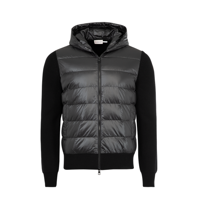 Image 1 of 3 - BLACK - MONCLER Padded Wool Zip-Up Hoodie featuring down-filled polyester front and hood, rib knit, gauge 7, zipper closure and pockets with snap button closure. 100% polyester. 100% virgin wool. Padding: 90% down, 10% feather. Made in Turkey.