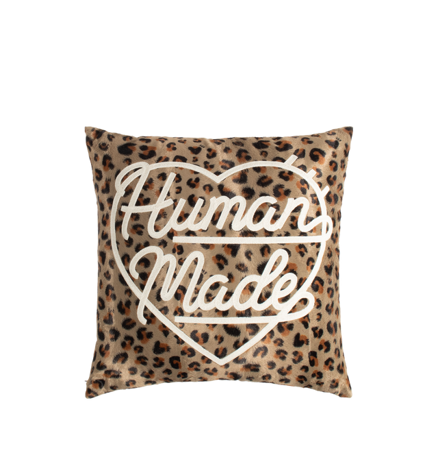 Image 1 of 2 - BROWN - Human Made Leopard Cushion features a bold leopard-print design and is crafted with a smooth cotton-rayon pile cover. Designed as a playful interior accent, it is finished with a chain-stitched Human Made logo, a lightweight polyester cushion insert, and a zip closure that allows the cover to be removed with ease. Main Material: Cotton/Rayon Pile Cover. Filling: Polyester Cushion Insert. Details: Leopard Pattern, Chain-Stitched Logo, Removable Zip Cover.