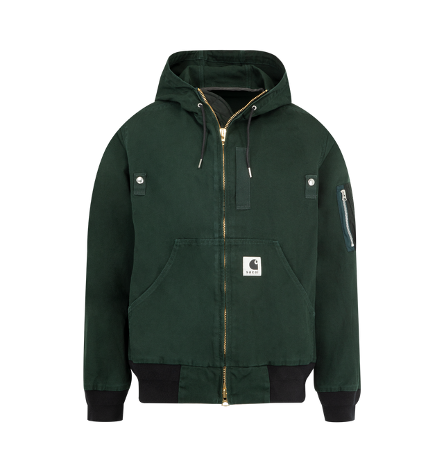 Image 1 of 3 - GREEN - SACAI X CARHARTT WIP Washed Duck Hooded Jacket featuring drawstring hood, drop shoulders, long sleeves, sleeve zip pocket, split kangaroo pocket, rib-knit trim and two-way front zip closure. 100% cotton. 100% nylon. Made in Japan.