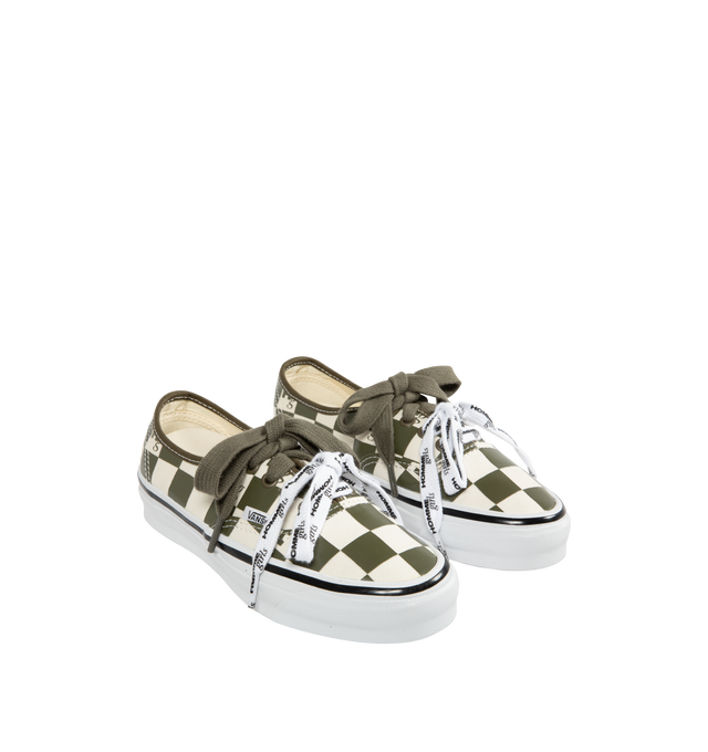 Image 2 of 5 - GREEN - VANS X HOMME GIRLS OTW Authentic 44 Sneaker featuring Heritage low-top shoe, Style 44, 8 oz canvas upper with 6 oz canvas bindings and heel strip, HommeGirls branded lace, with optional second lace, metal eyelets, higher sidewall with gloss finish, foxing tape, reinforced outsoles, Co-branded Foam ADC (All-Day Comfort) insole, signature waffle outsole pattern, all-over checkerboard pattern with Hg monograms and co-branded logo heel scab.