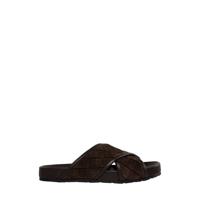 Image 1 of 4 - BLACK - BOTTEGA VENETA Tarik Intrecciato Suede Slide Sandals featuring signature woven intreccio suede with leather piping, flat heel, open toe, crisscross vamp, easy slide style and molded comfort footbed. Made in Italy. 