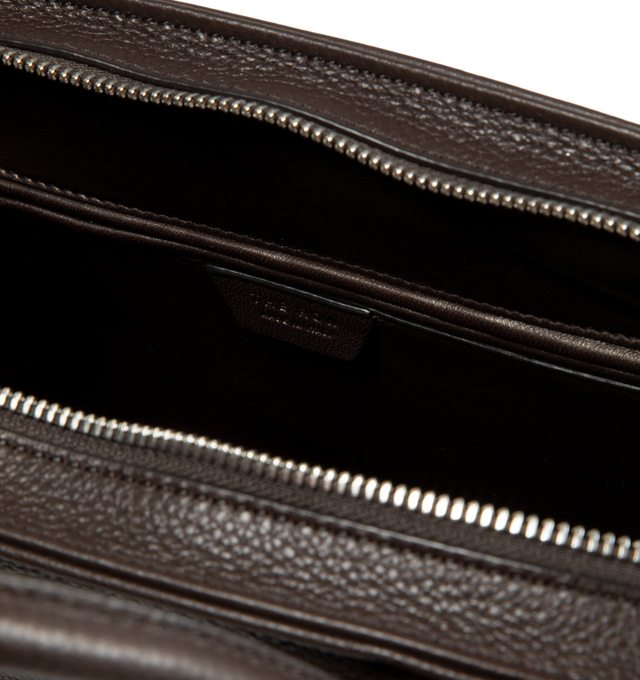 Image 4 of 4 - BROWN - The Row Agnes 12 Bag is crafted from finely grained calfskin leather and features a softly structured top-handle silhouette with tubular handles, gusseted side folds, a curved top zip closure, and a flat base. This designer leather handbag combines exceptional Italian craftsmanship with timeless minimalist design, offering a refined everyday carry with a spacious, elegant interior. Main Material: 100% Calfskin Leather. Lining: 100% Lambskin Leather. Dimensions: 12.99 x 5.91 x 8.27 in.