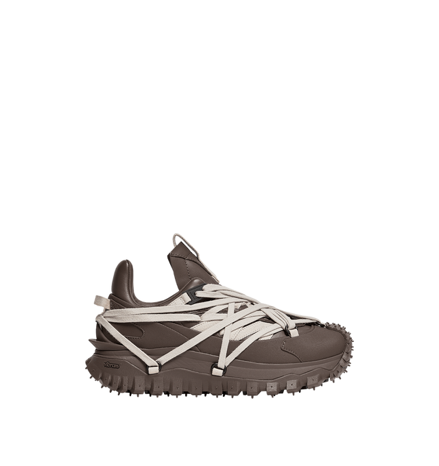 Image 1 of 1 - BROWN - RICK OWENS X MONCLER Trailgrip Megalace Leather Sneakers featuring leather, mesh lining, MEGALACE closure, TPU spoiler, EVA midsole, carbon fiber between midsole and tread, Special Vibram MEGAGRIP rubber compound and OrthoLite insole. Sole height 4.5 cm. 100% polyamide/nylon. Sole: 100% elastodiene.