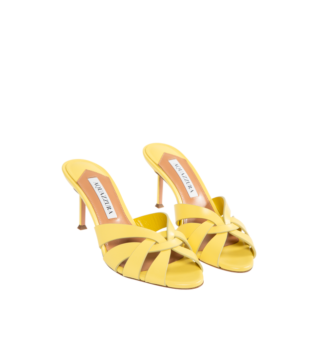 Image 2 of 4 - YELLOW - AQUAZZURA Copacabana Mule 75 featuring cage-like straps, low-cut vamp, slip-on style, mid heel, padded leather insole and signature logo detailing. 75 mm heel. Calf leather. Made in Italy.