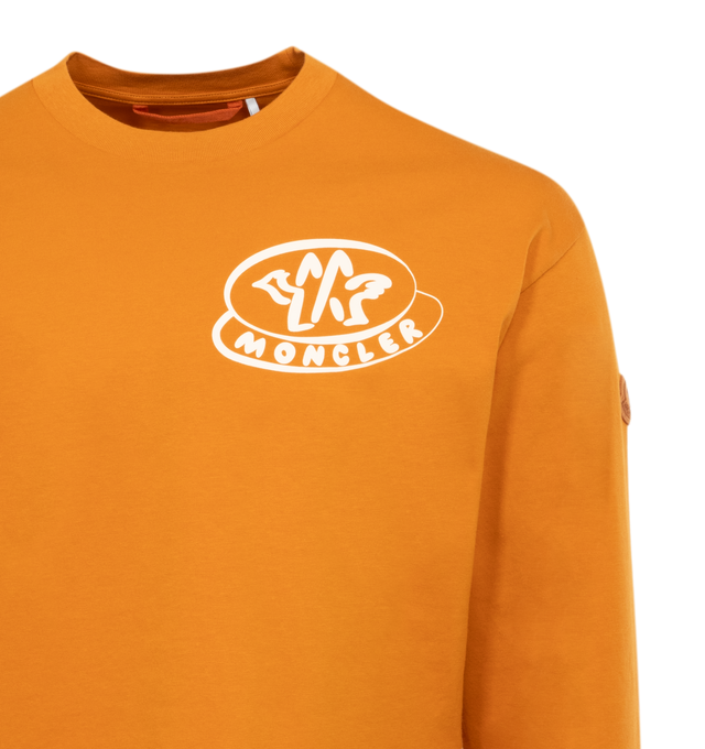 Image 2 of 2 - ORANGE - MONCLER Logo T-Shirt featuring organic cotton jersey, crew neck, long sleeves, printed logo and dyed logo patch. 100% cotton. Made in Turkey. 